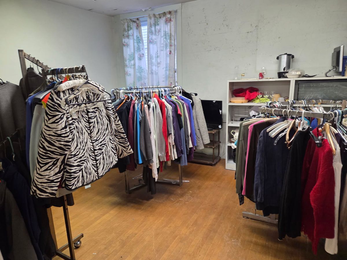 The pantry's clothing closet, with racks of donated clothing